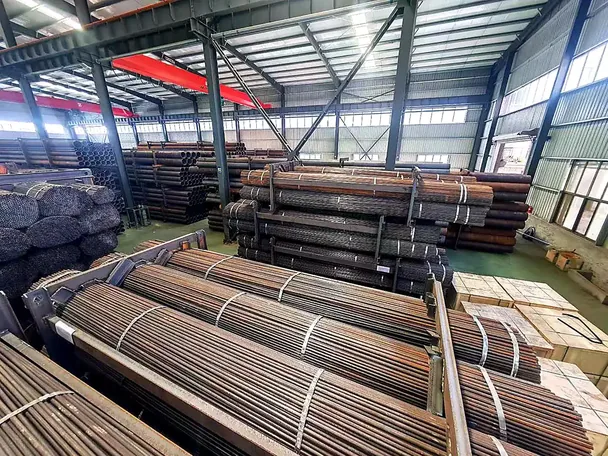 Steel pipe bundles strapped and stacked in the yard