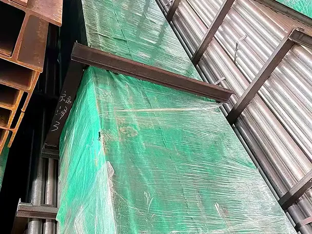 Steel sections wrapped in protective VCI sheeting on a pallet